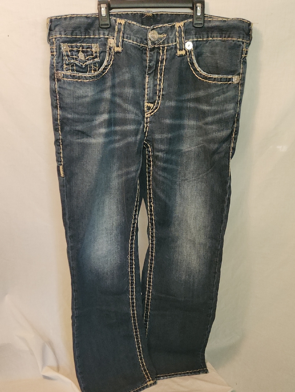 True Religion white tag with red logo and blue size print